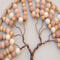 top part of tree beads are added to form the top portion and are uniform and even on both sides